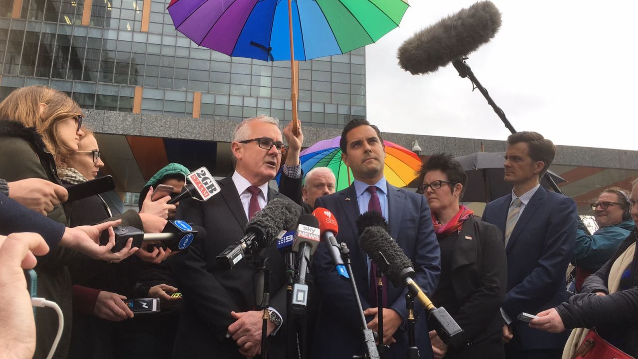 Australian independent political Andrew Wilkie (center left) speaks to media Thursday after High Court knocks down his challenge to same-sex marriage vote.