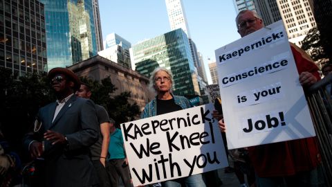 Activists rally in support of Colin Kaepernick outside the NFL offices on August 23, 2017