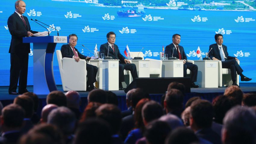 Russian President Vladimir Putin, left, speaks as South Korea's President Moon Jae-in, third from left, Mongolia's President Khaltmaagiin Battulga, second from right, and Japan's Prime Minister Shinzo Abe, right, listen during a plenary session titled "The Russian Far East: Creating a New Reality" at the Eastern Economic Forum in Vladivostok, Russia, Thursday, Sept. 7, 2017. Putin says he believes U.S. President Donald Trump's administration is willing to defuse tensions on the Korean Peninsula. (Vladimir Smirnov/TASS News Agency Pool Photo via AP)