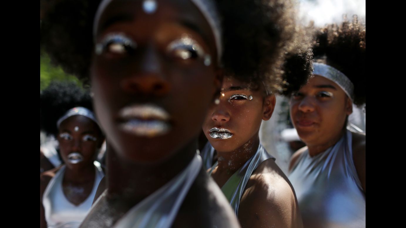 The Visions in Motion dance group prepares to march in New York City for the West Indian American Day Parade on Monday, September 4.