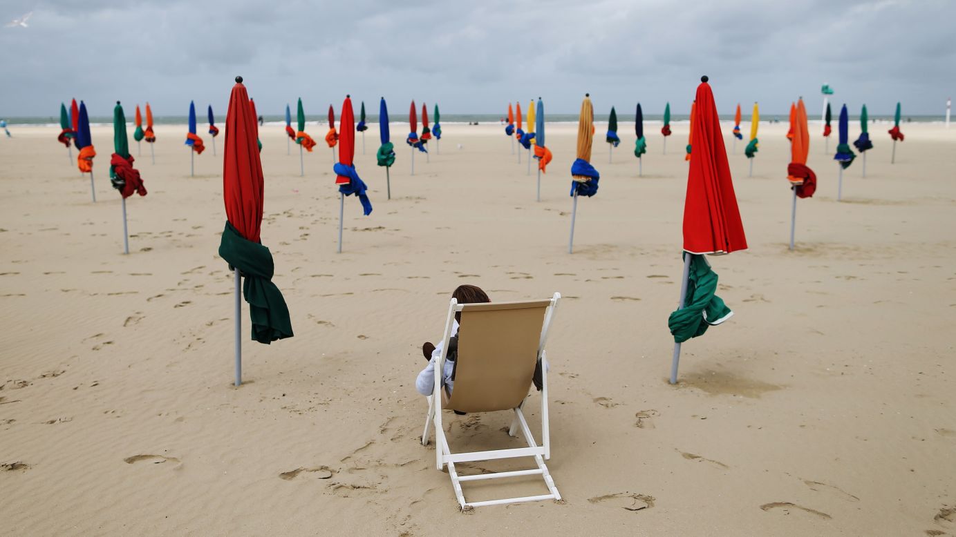 A man sitting in a deckchair reads on a beach in Deauville, France, on Wednesday, September 6.