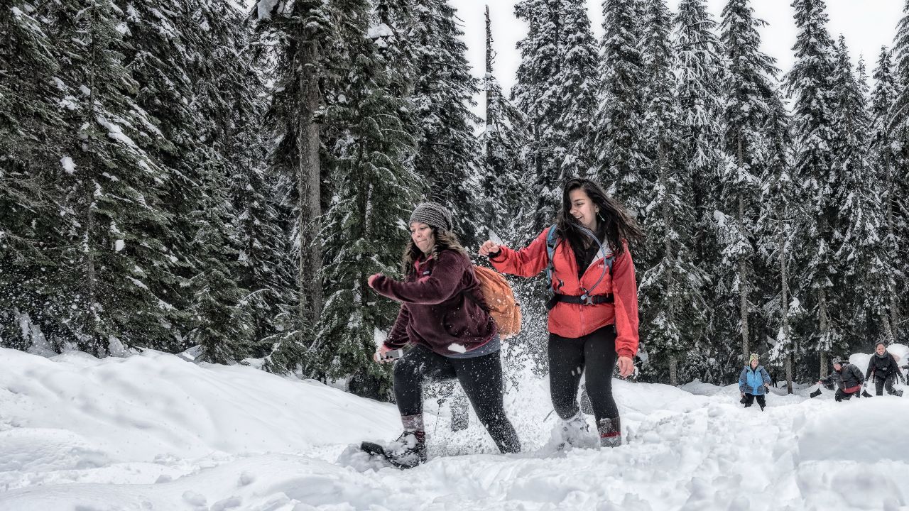 Lylianna Allala, left, an outreach coordinator, races Michelle Piñon, a regional coordinator for Latino Outdoors and trip leader at the Washington Trails Association, at Snoqualmie Pass.