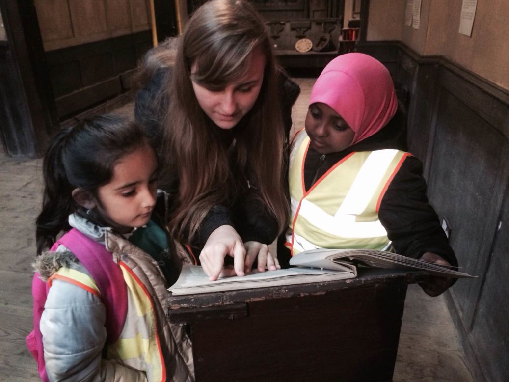 <strong>Britain's Museum of Immigration and Diversity: </strong>A volunteer educator talks with local school students at Britain's Museum of Immigration and Diversity, which is located in the Georgian former home of a French Huguenot silk maker. <br />