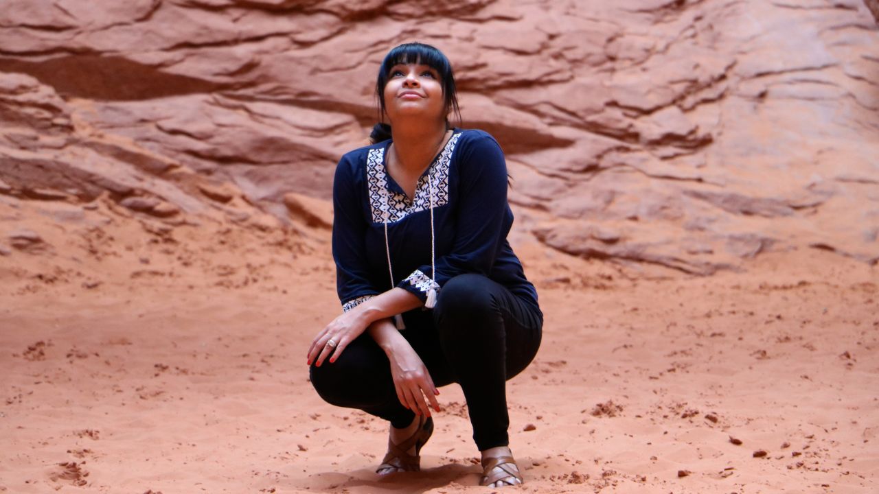 Through an Instagram account, Ambreen Tariq -- here at Arches National Park in Utah -- explores what it means to be a person of color in the outdoors.