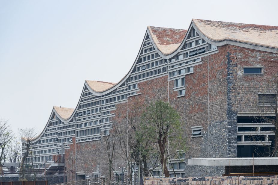 Shortly after winning the prestigious Pritzker Prize in 2012, architect Wang Shu and his firm Amateur Architecture Studio were invited to design this cultural complex in Fuyang, Anhui province.