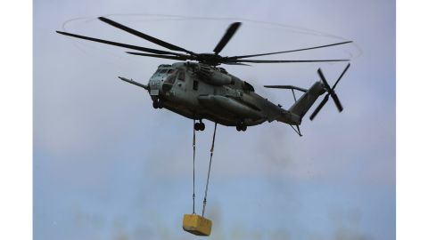 A CH-53E Super Stallion carries a 20,000-pound training load during external lift training at Marine Corps Base Camp Pendleton in California on June 5.