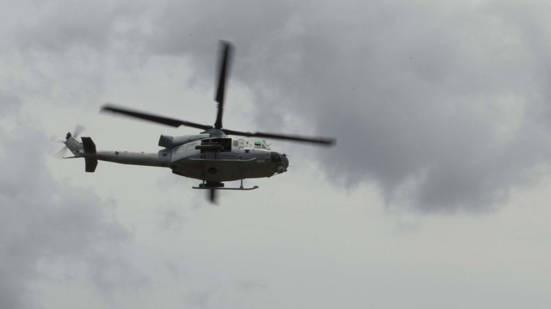 A UH-1Y Huey utility helicopter passes overhead during close air support training in North Carolina on August 3. 