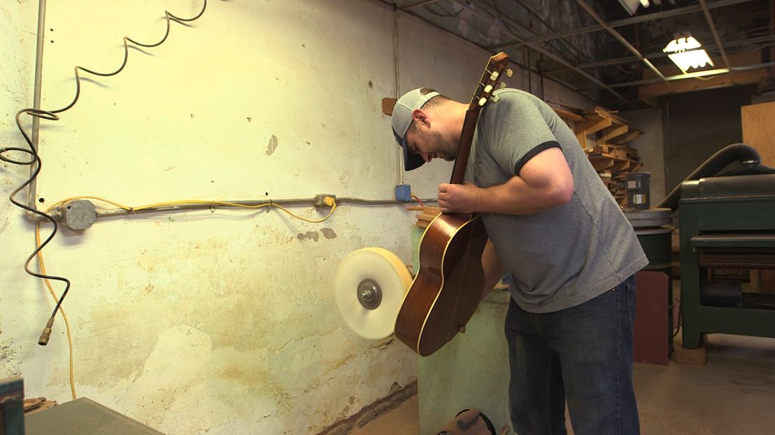 Stephen Gallagher works on a guitar at his family's shop in Wartrace, Tennessee.