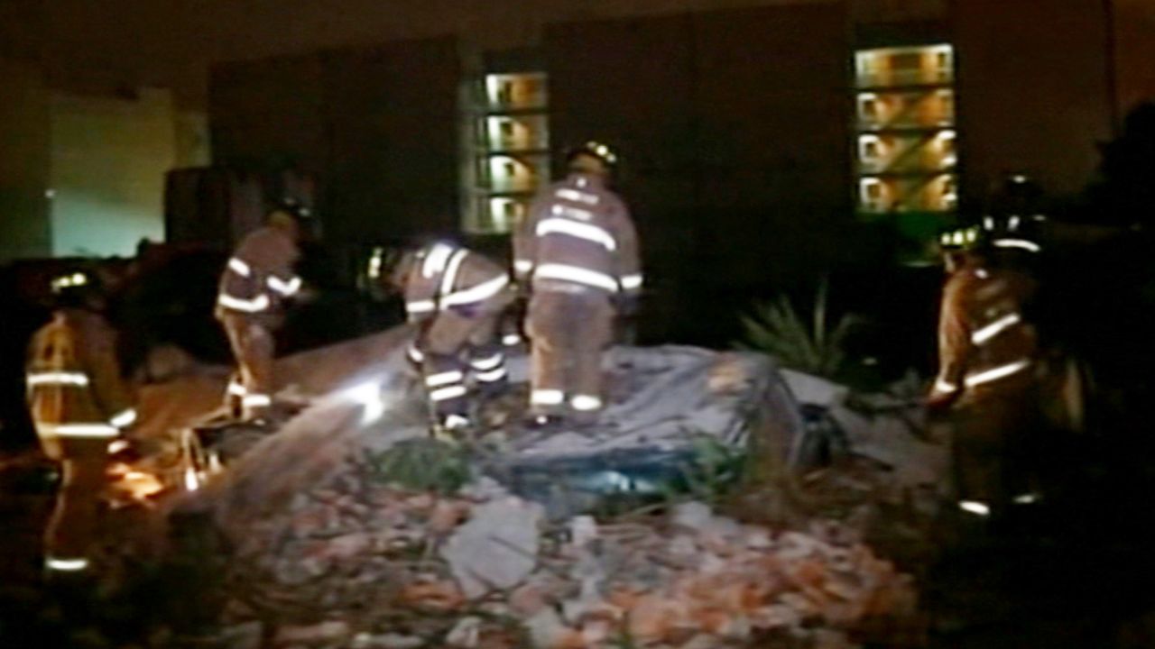 First responders survey the scene after the quake.