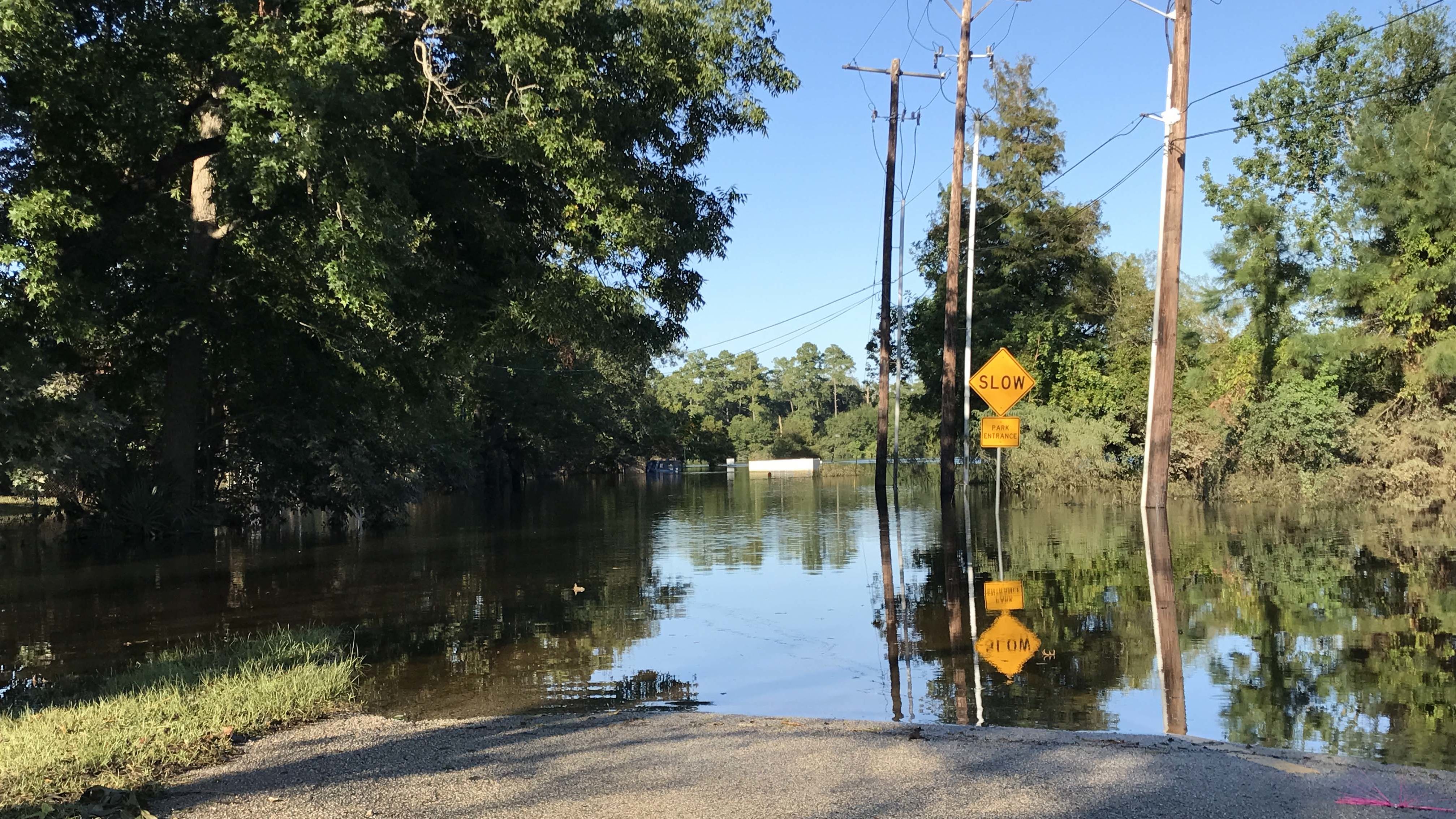 A road in Beaumont, Texas, is still flooded, two weeks after Hurricane Harvey dumped more than 50 inches of rain on parts of the state.