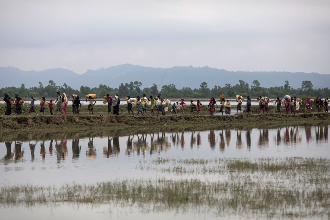 Rohingya Muslim refugees make their way into Bangladesh after crossing the border on September 07.