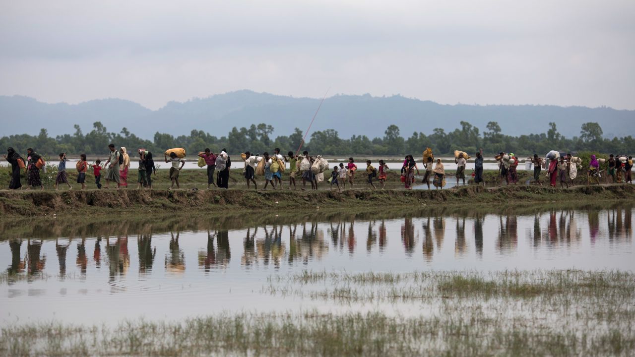 Rohingya Muslim refugees make their way into Bangladesh after crossing the border on September 07.