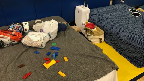 The Espiritu family settles in with what they could bring to the Weston shelter.