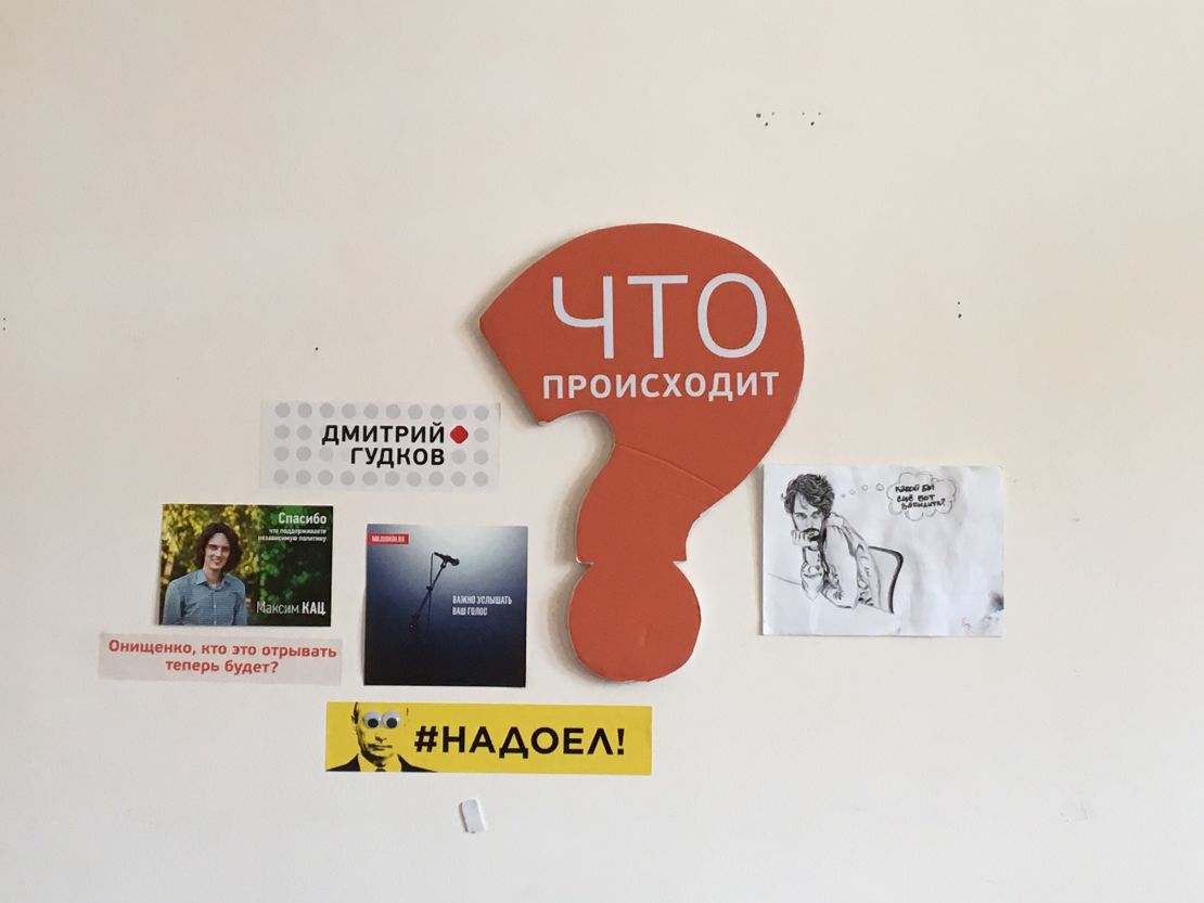 Opposition slogans, such as a yellow sticker featuring Putin's face and the words "#fedup," is seen inside the movement's headquarters in Moscow in August. 