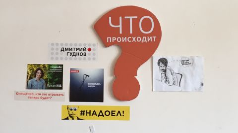 Opposition slogans, such as a yellow sticker featuring Putin's face and the words "#fedup," is seen inside the movement's headquarters in Moscow in August.