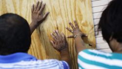 Richard Jay, left, and his wife Shanta board up their motel ahead of Hurricane Irma in Daytona Beach, Fla., Friday, Sept. 8, 2017. Coastal residents around South Florida have been ordered to evacuate as the killer storm closes in on the peninsula for what could be a catastrophic blow this weekend. (AP Photo/David Goldman)