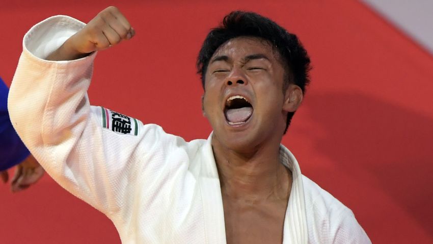 Japan's Soichi Hashimoto (white) celebrates his victory over Azerbaian's Rustam Orujov (not pictured) after their final in the mens -73kg category at the World Judo Championships in Budapest on August 30, 2017.  / AFP PHOTO / ATTILA KISBENEDEK        (Photo credit should read ATTILA KISBENEDEK/AFP/Getty Images)