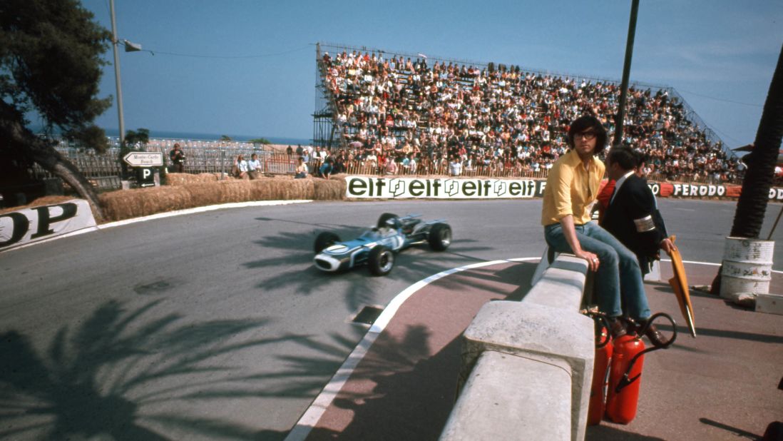 Spectators sit on the walls next to the urban circuit at the Monaco Grand Prix, 1968.