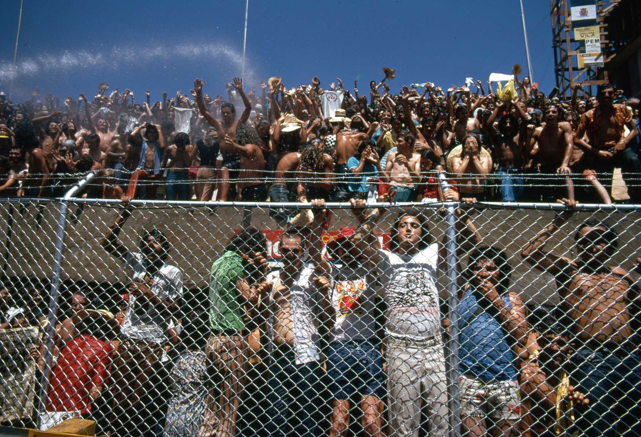 Crowds of excited fans watch the 1973 Brazil Grand Prix -- the first world championship held in the country -- under the blazing sun.