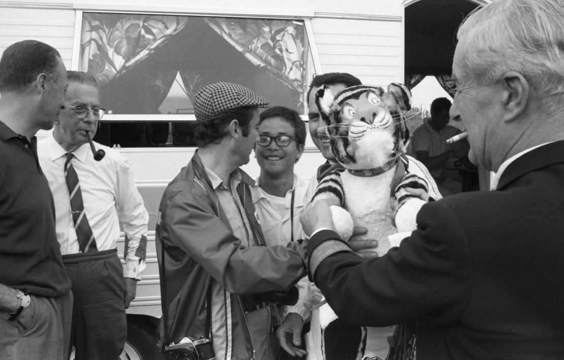 Joe Honda (center) with the President of the International Racing Press Association Bernard Cahier (center left) and Jack Brabham, the winner of the French Grand Prix, 1967.