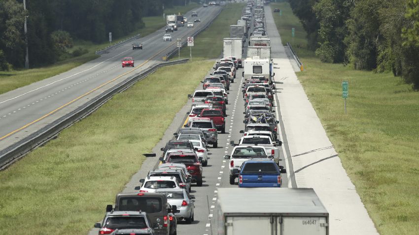 Traffic rolls at a crawl on the northbound lanes of Florida's Turnpike near the intersection of I-75 in Wildwood, Friday, Sept. 8, 2017. Motorists are evacuating for the anticipated arrival of Hurricane Irma. (Stephen M. Dowell/Orlando Sentinel via AP)