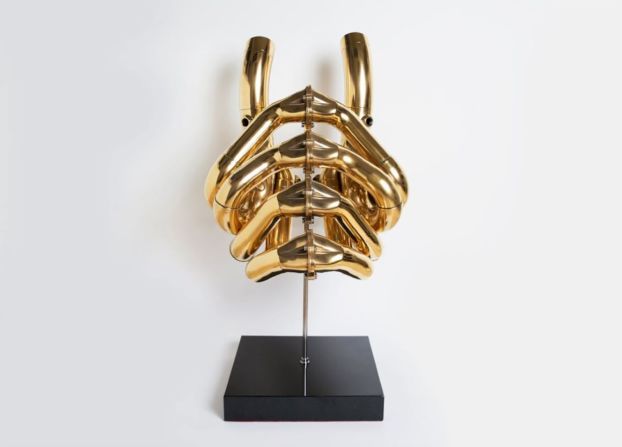 This piece is available to buy in Bitcoin at Dadiani Gallery in London. It's a sculpture made out of a used Formula 1 car engine. 