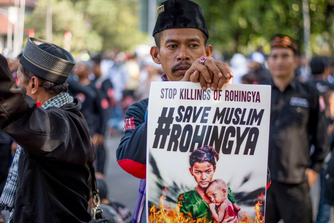 A protester holds a sign during an anti-Myanmar rally in Jakarta, Indonesia, on September 8, 2017.