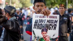A demonstrator displays a placard during an anti-Myanmar rally to condemn the worsening humanitarian situation in Rakhine state, in front of the Myanmar embassy in Jakarta on September 8, 2017.
Persecution of Rohingya Muslims, reviled as illegal immigrants and mostly denied citizenship in Myanmar, has been a lightning rod for anger in Indonesia and across the Muslim world. / AFP PHOTO / Bay ISMOYO        (Photo credit should read BAY ISMOYO/AFP/Getty Images)