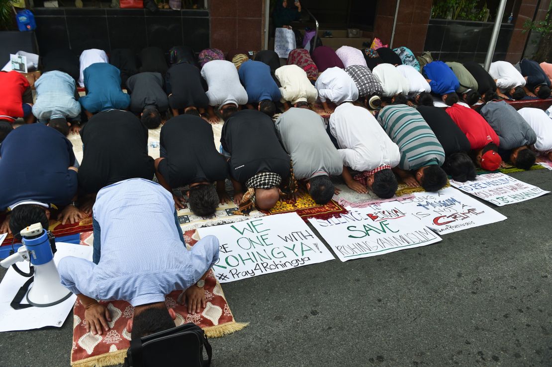 Philippine Muslims pray during a protest in front of the Myanmar embassy in Manila on September 8, 2017.