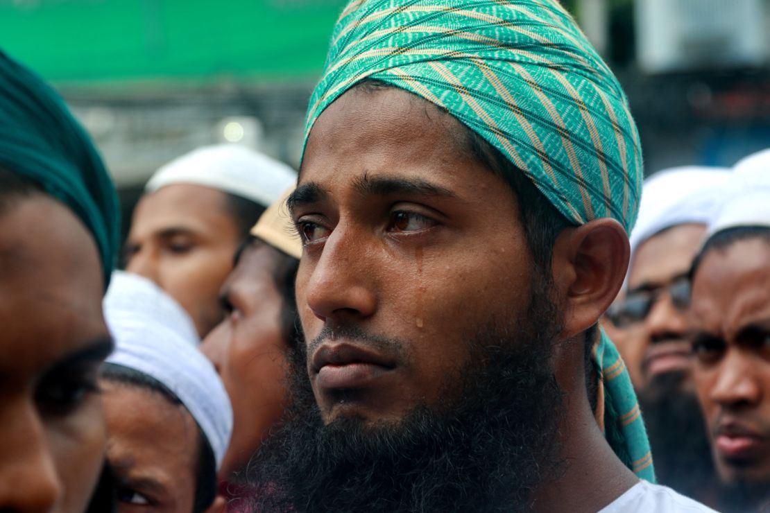A protester cries as he listens to a preacher describing the plight of the Rohingya during a rally in Dhaka, Bangladesh on September 8, 2017. 