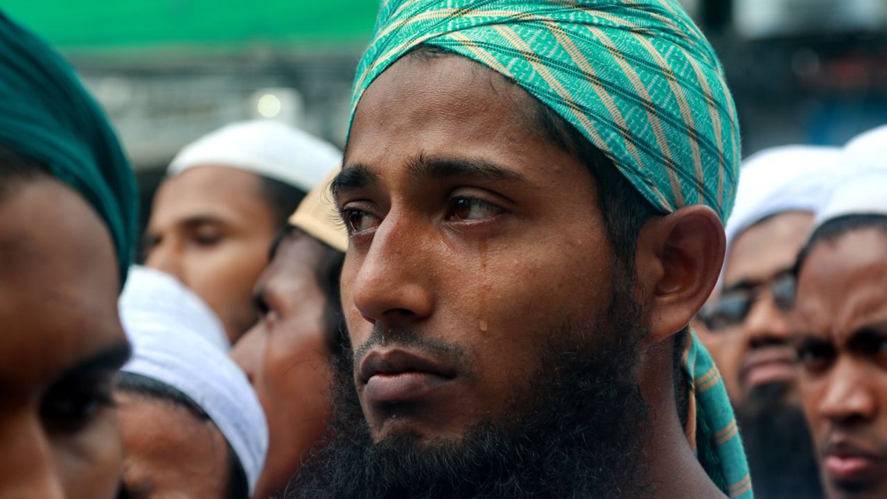 A protester cries as he listens to a preacher describing the plight of the Rohingya during a rally in Dhaka, Bangladesh on September 8, 2017. 