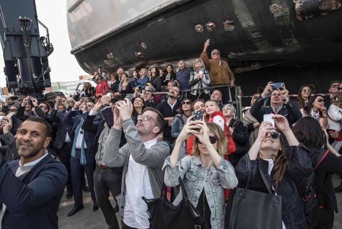 The crowd at the Aurora's unveiling is a mix of friends of the owner, Rossinavi employees and their families, and locals from Viareggio.