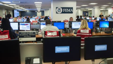 Employees work on computers inside the FEMA Command Center at Federal Emergency Management Agency Headquarters in Washington, DC, August 4, 2017. / AFP PHOTO / SAUL LOEB (Photo credit should read SAUL LOEB/AFP/Getty Images)