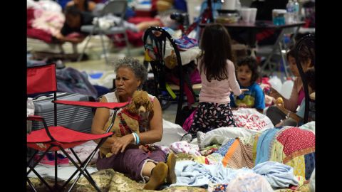 People sit in the Miami-Dade County Fair Expo Center as Irma approached Miami on Saturday, September 9. <a href="http://www.cnn.com/2017/09/07/americas/gallery/hurricane-irma-caribbean/index.html">See Hurricane Irma's impact on the Caribbean</a>