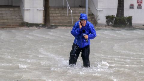 Weather Channel meteorologist Mike Seidel fights fierce winds and flooded streets while reporting in Miami on September 10.