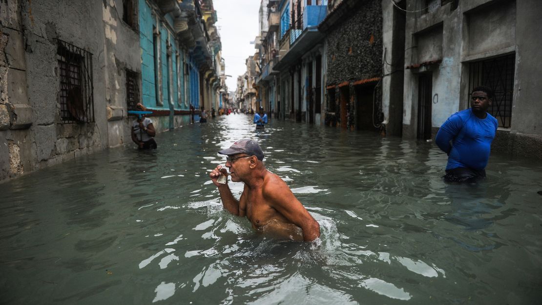 A Cuban man wades through a flooded street in Havana on September 10.
