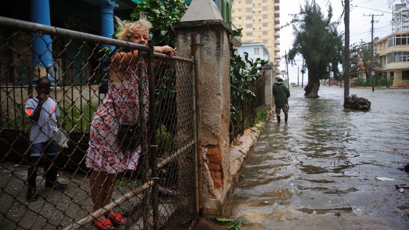 A woman surveys flooding in Havana on September 9. 