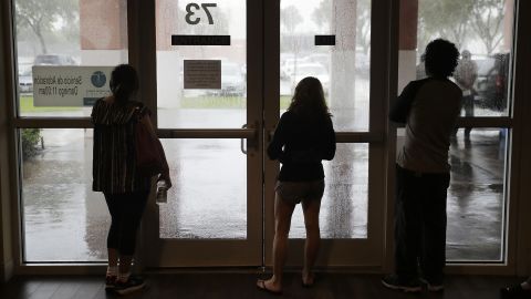 Evacuees in Naples watch from inside a shelter as Irma inches closer on September 10.