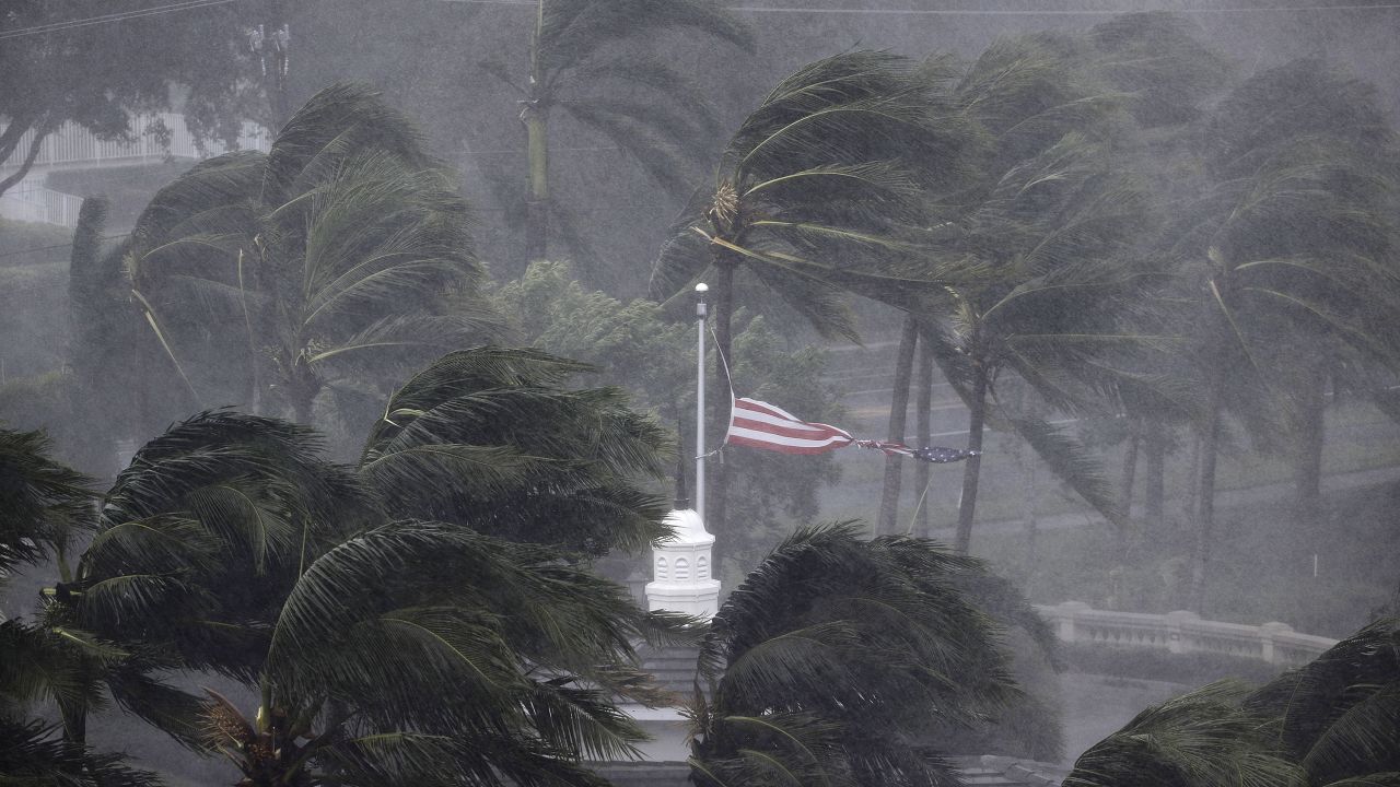 An American flag is torn as Irma passes through Naples on September 10.