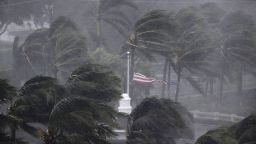 An American flag is torn as Hurricane Irma passes through Naples, Florida on September 10.