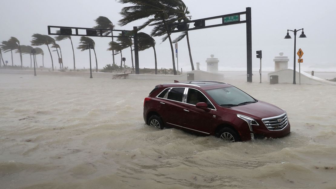 An abandoned car is overtaken by storm surge as Hurricane Irma hits Fort Lauderdale on September 10.