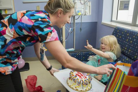 Lauren Gray, a cancer unit nurse, brought Willow the cake for her third birthday party.<br />