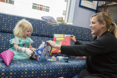 Kara Dixon, a cancer unit nurse, helped Willow open gifts.