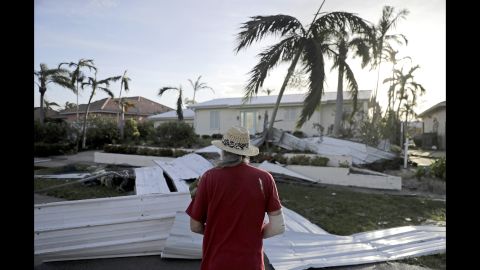 Rick Freedman checks damage to his neighbor's home in Marco Island on September 11.