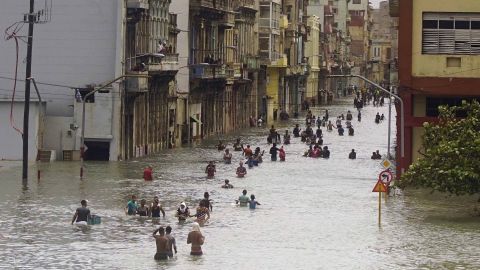People move through flooded streets in Havana after the passage of Hurricane Irma on Sunday.