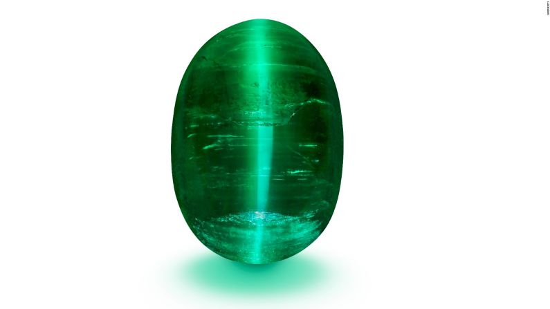 An extremely rare cabochon cat's eye emerald, the "Jaguar's Eye" exemplifies the deep, blue-green hues typical of Muzo emeralds. The stone's name, Guernsey's says, recalls a moment when a young Marcial de Gomar spotted a jaguar in the Colombia rainforest.
