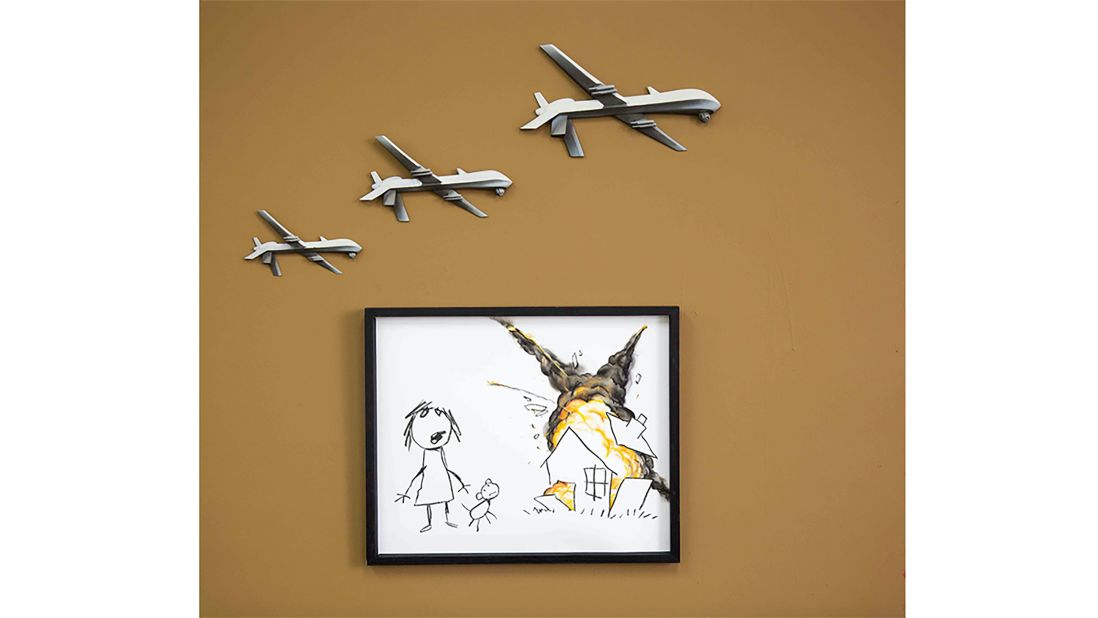 British street artist Banky's most recent work of political art, "Civilian Air Strike" was revealed in London on Monday. 