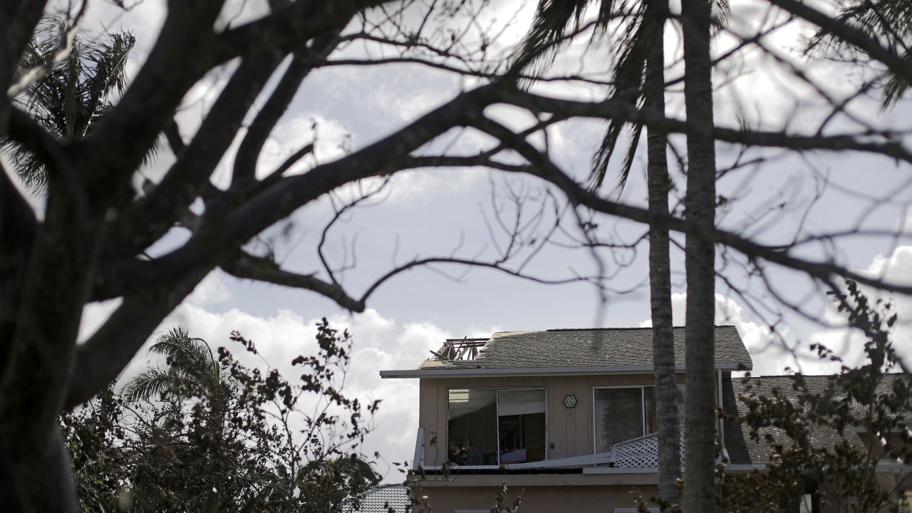 The roof of a home is damaged from Hurricane Irma in Marco Island, Florida on September 11.