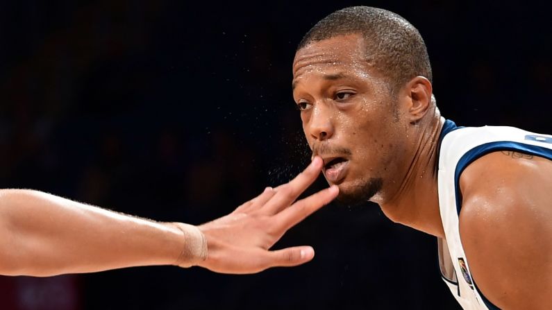 Slovenia forward Anthony Randolph is poked in the face by a Ukrainian defender during a basketball game in Istanbul on Saturday, September 9. Slovenia won 79-55 to advance to the quarterfinals of the EuroBasket tournament.