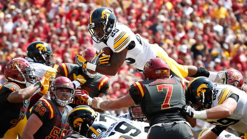 Iowa running back Akrum Wadley leaps for a 1-yard touchdown during the rivalry game at Iowa State on Saturday, September 9. Wadley scored two touchdowns and had nearly 200 yards of offense as Iowa won 44-41 in overtime.